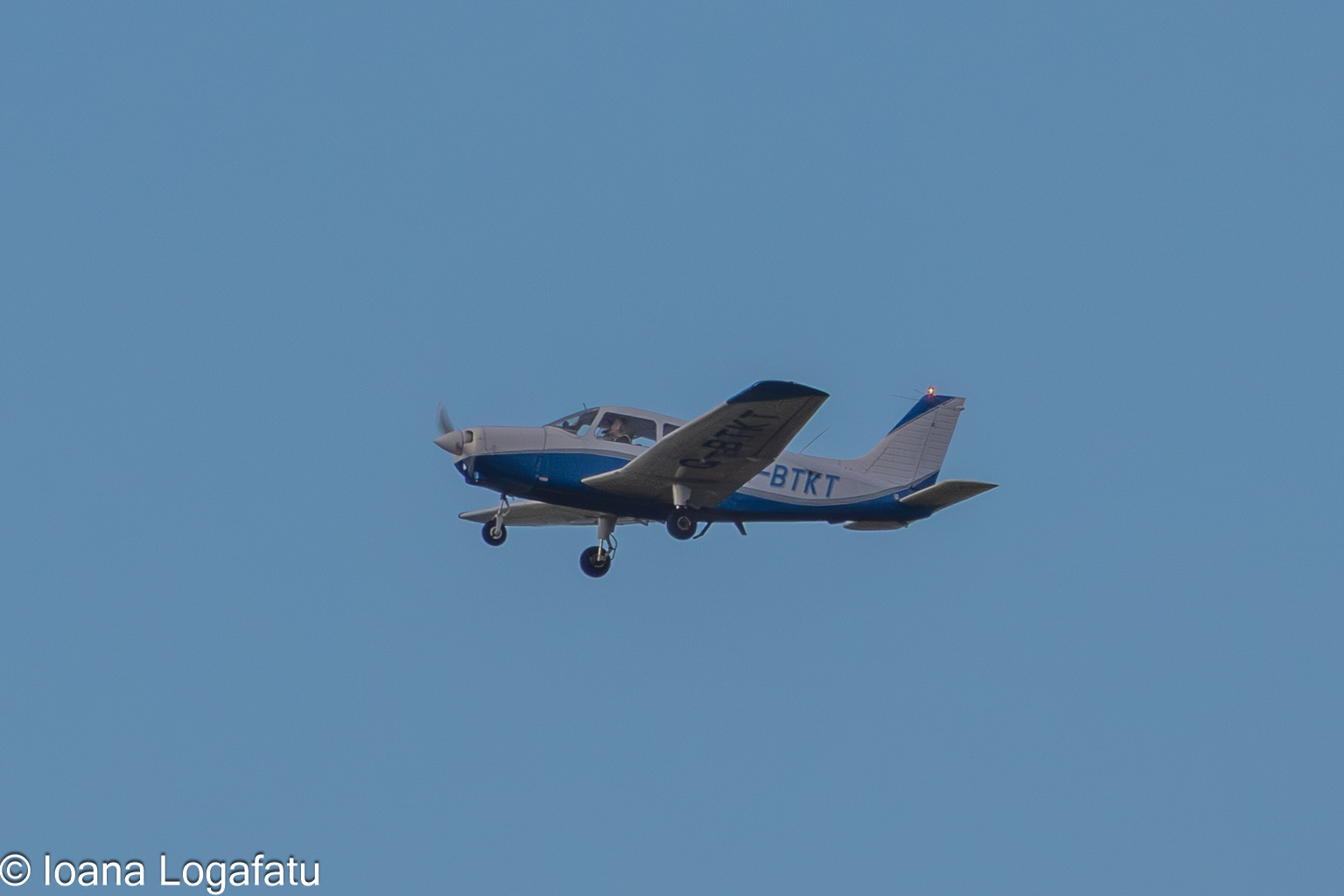 Small plane gliding in clear skies